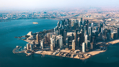 Aerial view of Doha's coastline surrounded by water - La Maison Hotel, Doha