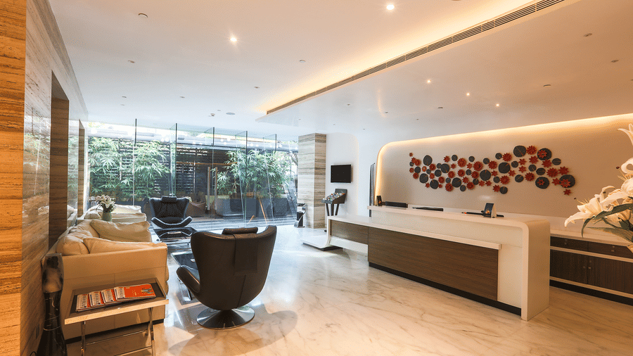 A picture of  lounge at Empresa hotel, featuring seating arrangements.