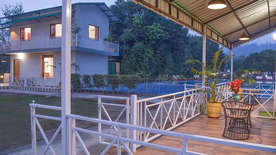 Private balcony with seating at The Tattwaa Corbett Spa & Resort.