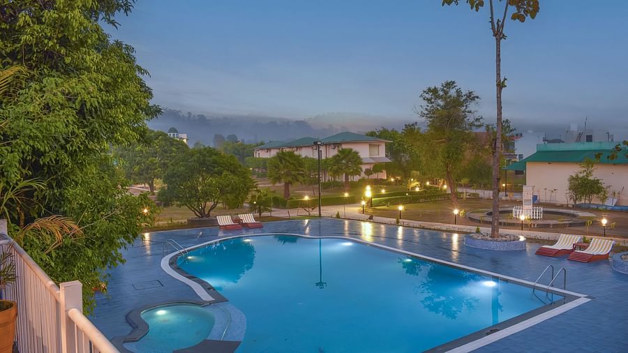 Swimming pool with scenic views at The Tattwaa Corbett Spa & Resort.