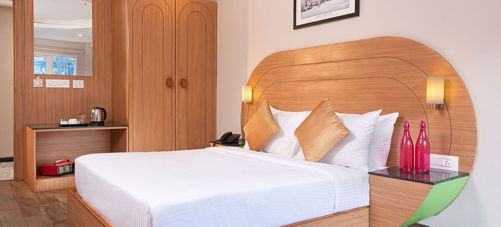 An image of a well furnished bedrooom  | Mango HIll Central, Ooty
