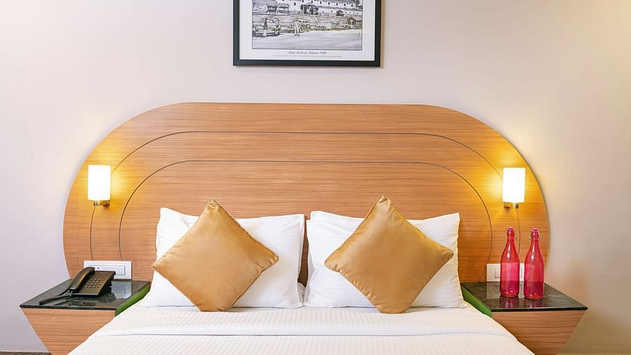An image of a double sized bed | Mango HIll Central, Ooty