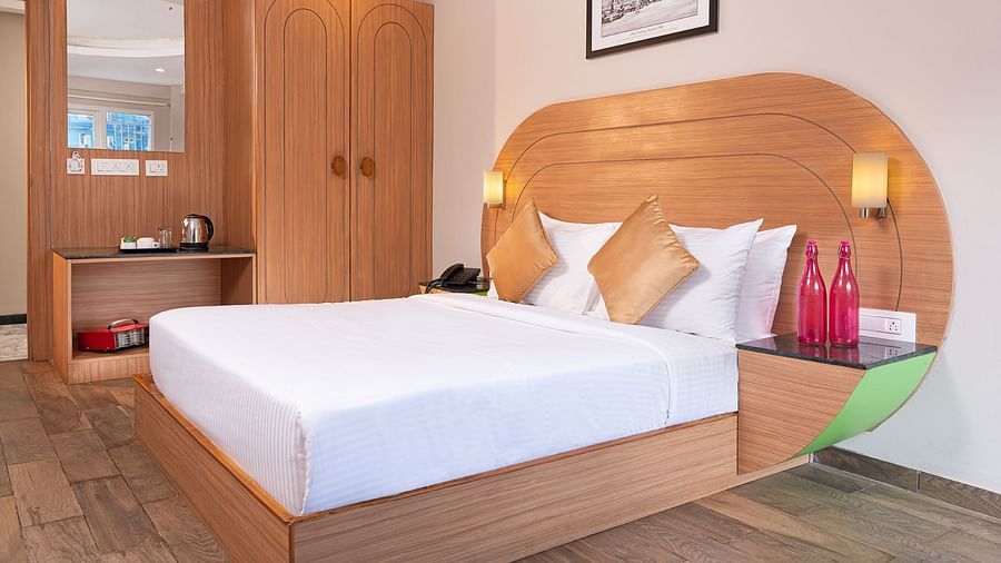 An image of a well furnished bedrooom  | Mango HIll Central, Ooty