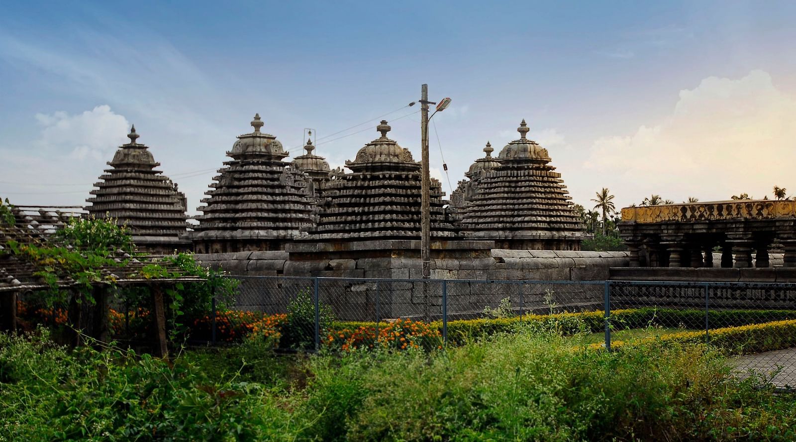 image of atemple nestled amids lush greenery in hassan