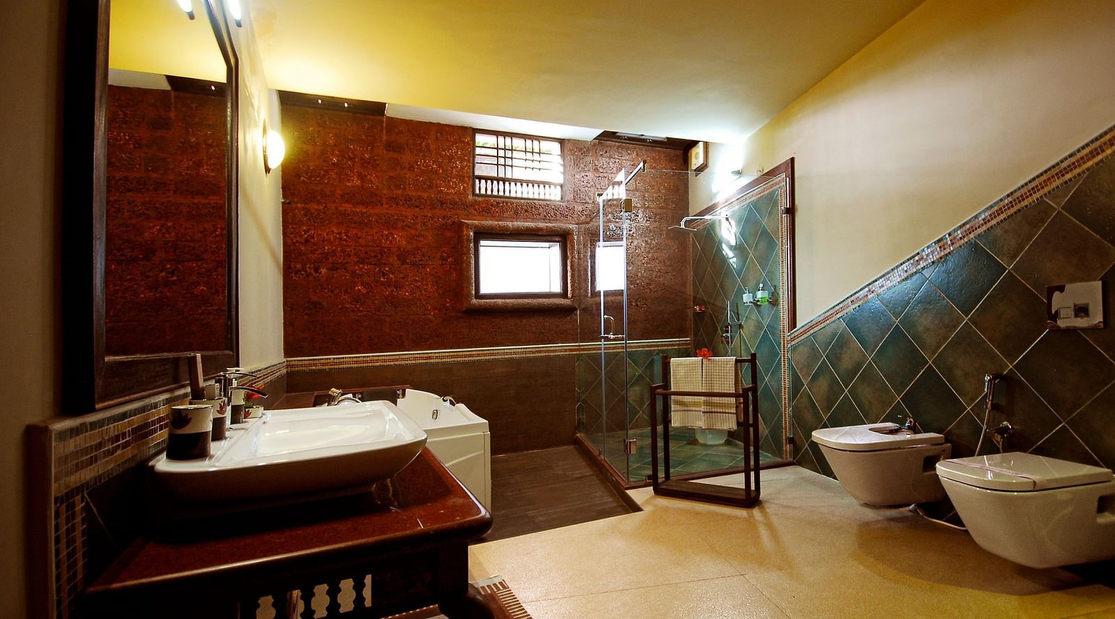 image of the well appointed bathroom with a jacuzzi at the luxury jucuzzi villa at hoysala village resort, hassan