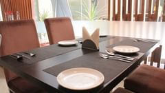 Dining table with cutlery laid out