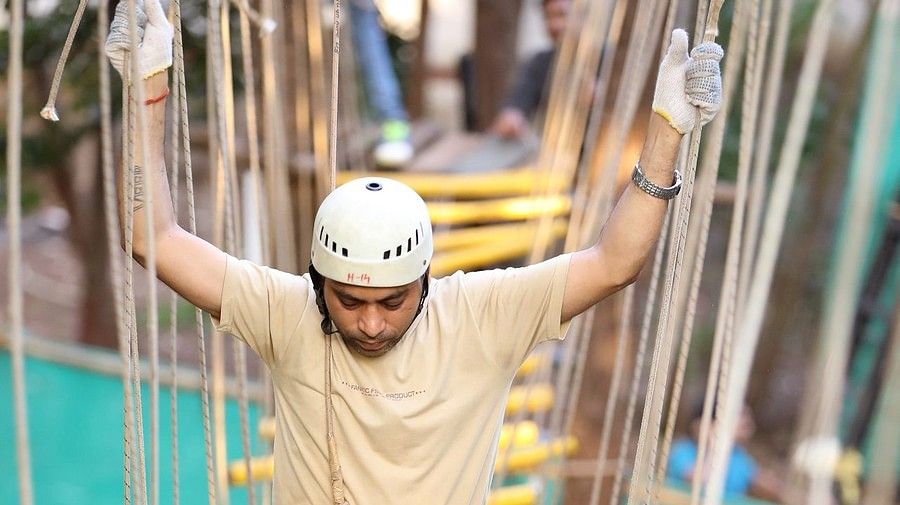 Skywalk - Sajan - walking above yellow thin sttrips in zig zag shape at an height.