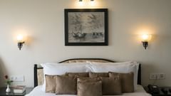 a bed with beautifully stacked pillows at one of the Misty Mountain Villas