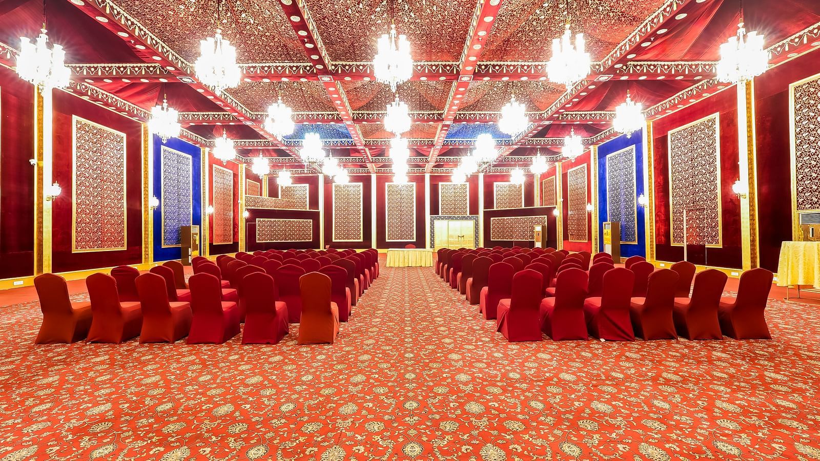 An overview of a large banquet hall with theatre style seating - Rajasthali Resort & Spa, Jaipur.