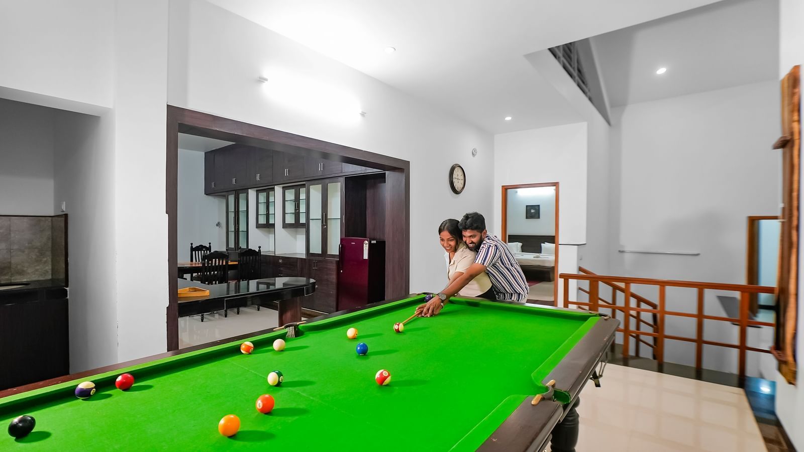 A view of a couple playing pool at WOW Bungalow, Yercaud. 
