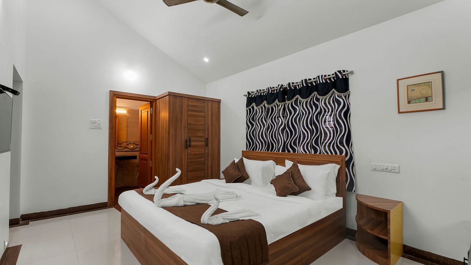 Modern bathroom with a bathtub, western toilet and a wash basin at WOW Bungalow, Yercaud.