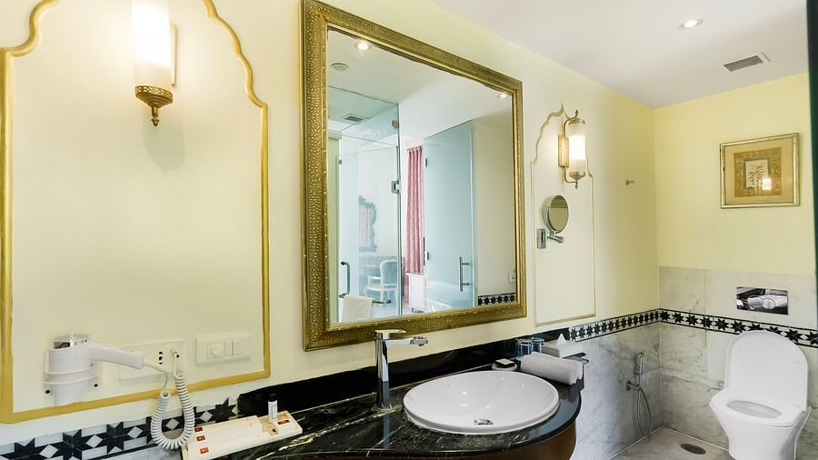 An overview of a bathroom inside one of the room with sink area in view - Rajasthali Resort & Spa, Jaipur.