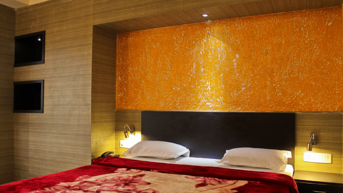 Interior of the Super Deluxe Room, a family hotel room in Bhilwara at The Palm Resort