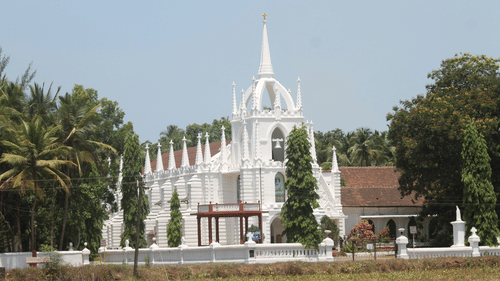 image of A Church in Goa surrounded by trees and greenery