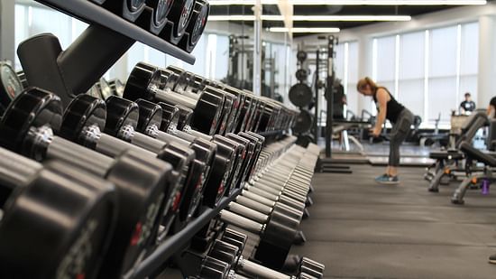 A close shot of dumbbells placed in a row