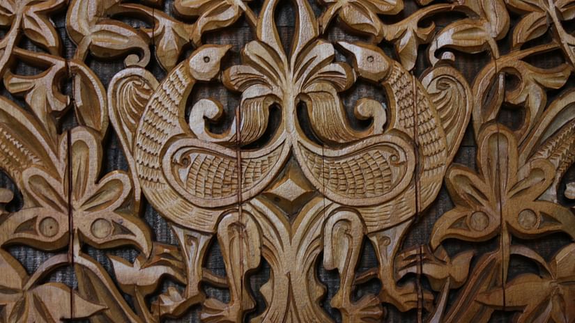 a close up shot of an intricately carved wood with different patterns