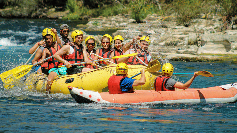 Group of people rafting on a boating on the river.