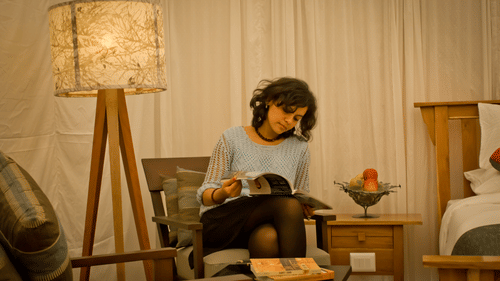a girl reading a magazine - The Golden tusk