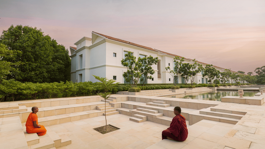 Sarovar Hotels meditation court with guests seated on stepped open space within the hotel campus.
