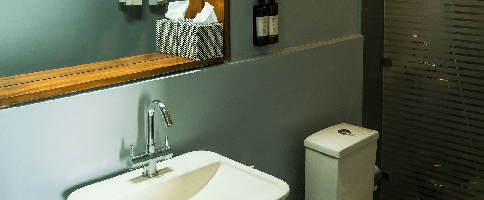 A bathroom featuring a geyser and toiletries at BluSalzz Escapade Resort, Lansdowne