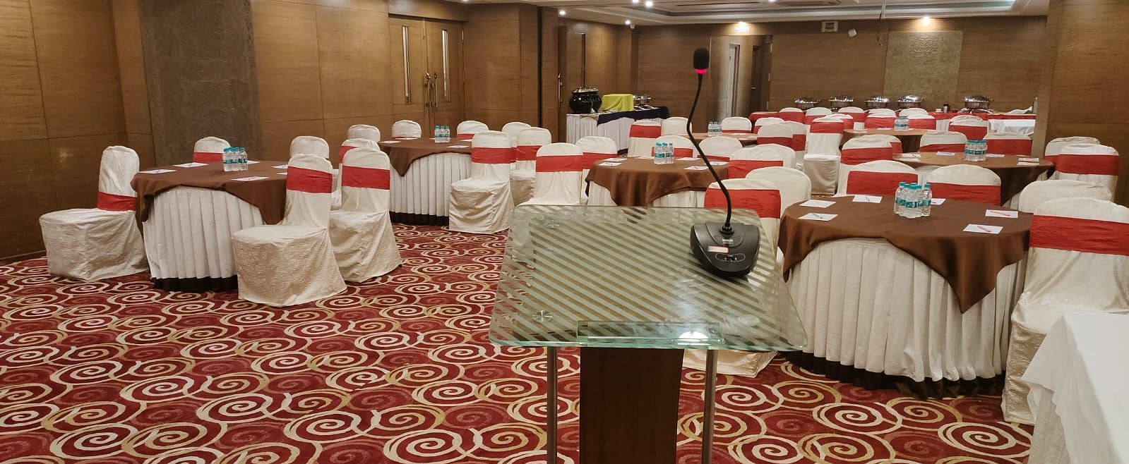 A spacious and elegant hotel room with a flat-screen TV and a welcoming ambience at The President Hotel Jayanagar, Bangalore