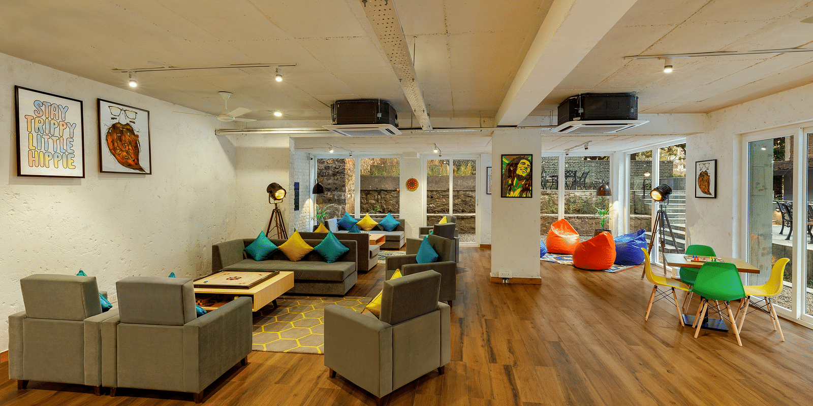 Cosy seating area with carom board and chessboard for leisure and games at Bedzzz, Rishikesh