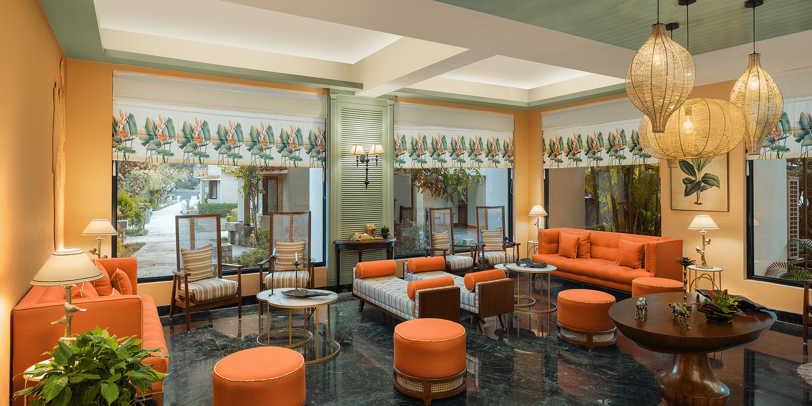An image of a seating area with many sofa and centre table near the lobby - The Riverview Retreat, Corbett 