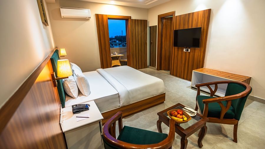bedroom with bed, side table and chair