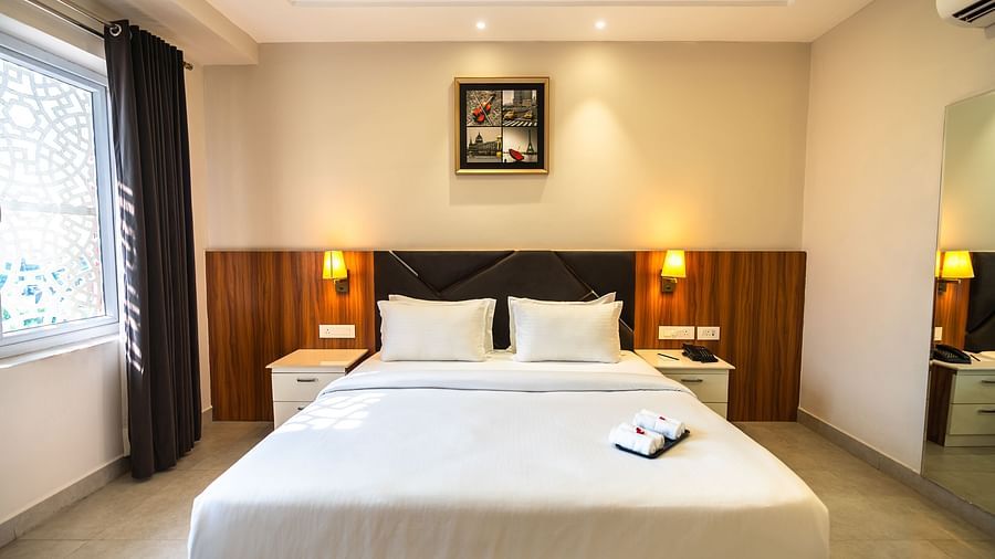 double bed with side lamp in the suite room