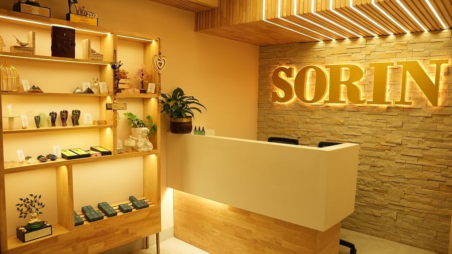 Reception area with a desk and products kept on display next to it - IOSIS Spa & Wellness