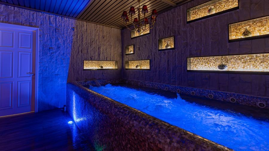 alt-text An image of the Jacuzzi with water bubbling - The Manor Luxury Hotel, Shimla
