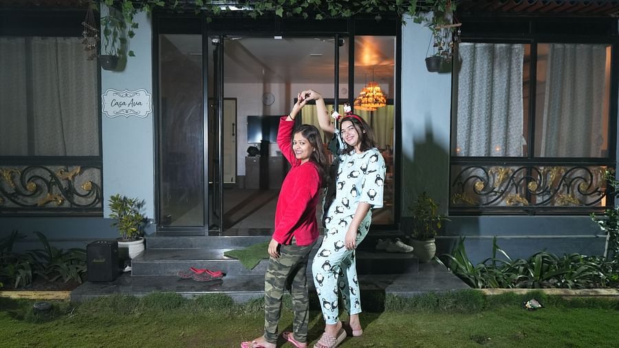 Mother and two children in pajamas posing in front of their house at night with soft lighting |  Diamond Parks, Pune 