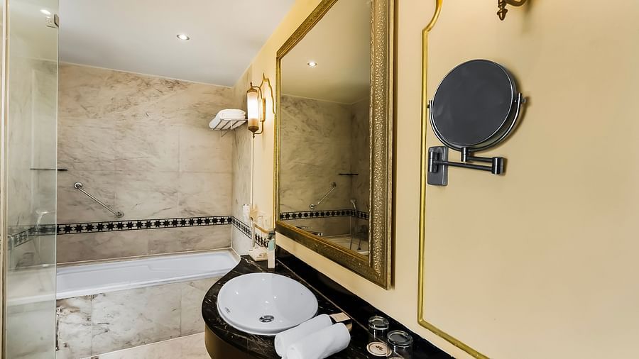 An overview of a bathroom inside one of the rooms with a bathtub in view - Rajasthali Resort & Spa, Jaipur.