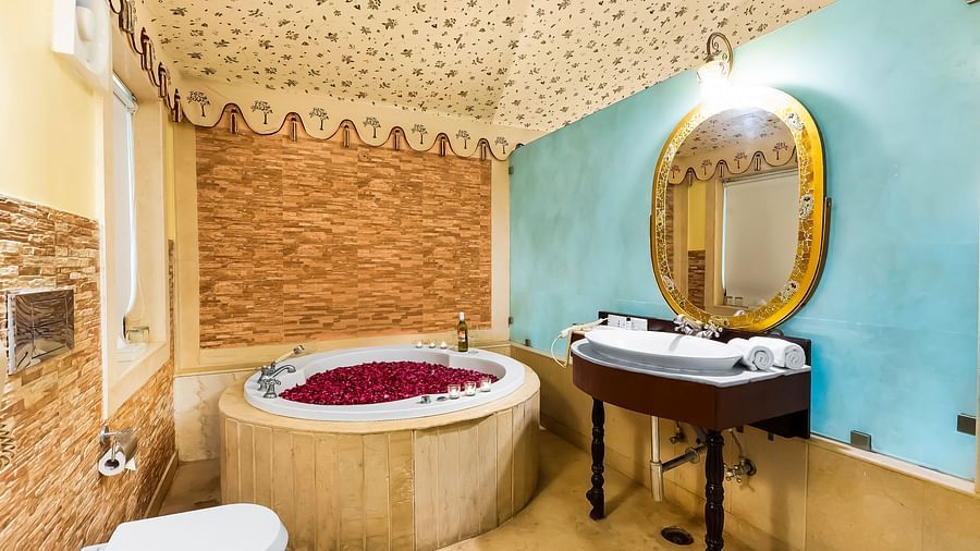 An overview of a bathroom with a round bathtub seen - Rajasthali Resort & Spa, Jaipur.