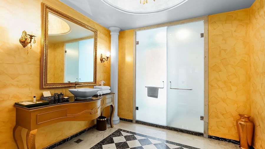 An overview of a bathroom with the sink area and wash area seen - Rajasthali Resort & Spa, Jaipur.
