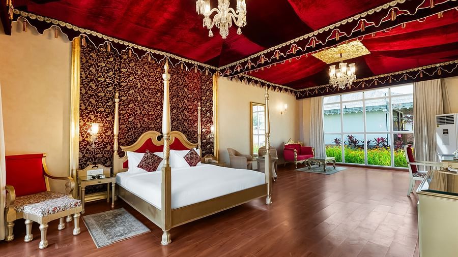 An overview of a room with a double bed, side tables and lamps seen - Rajasthali Resort & Spa, Jaipur.
