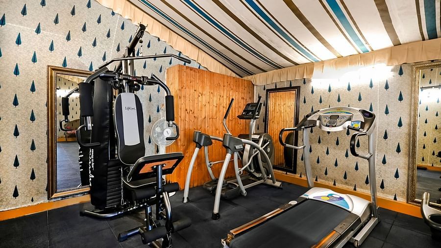 An overview of the fitness centre with an all in one workout machine in view - Rajasthali Resort & Spa, Jaipur.
