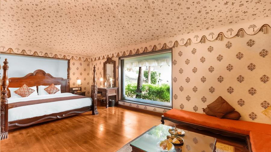 An overview of a room with a double bed, sofas and a coffee table seen - Rajasthali Resort & Spa, Jaipur.