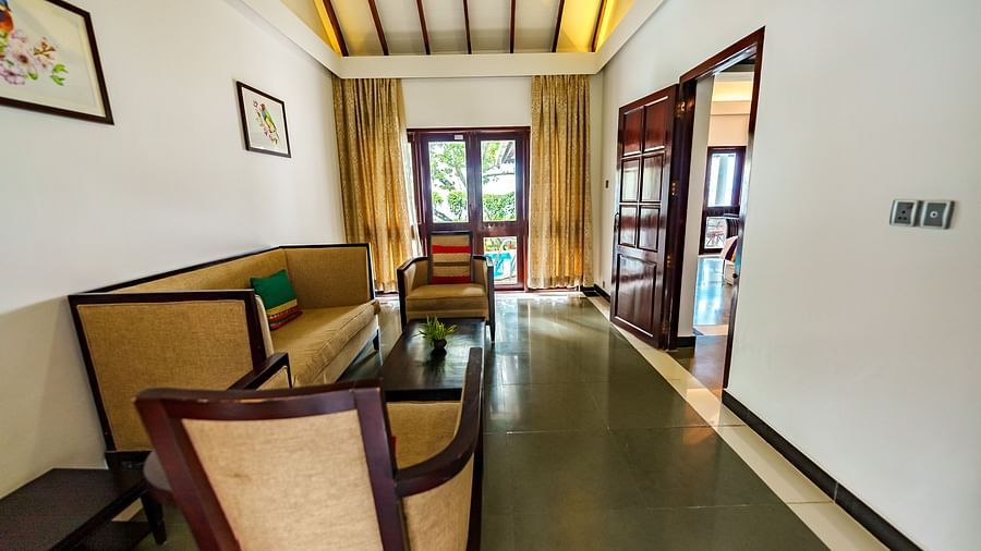 Rhythm Kumarakom - A sofa set in the living room with a coffee table
