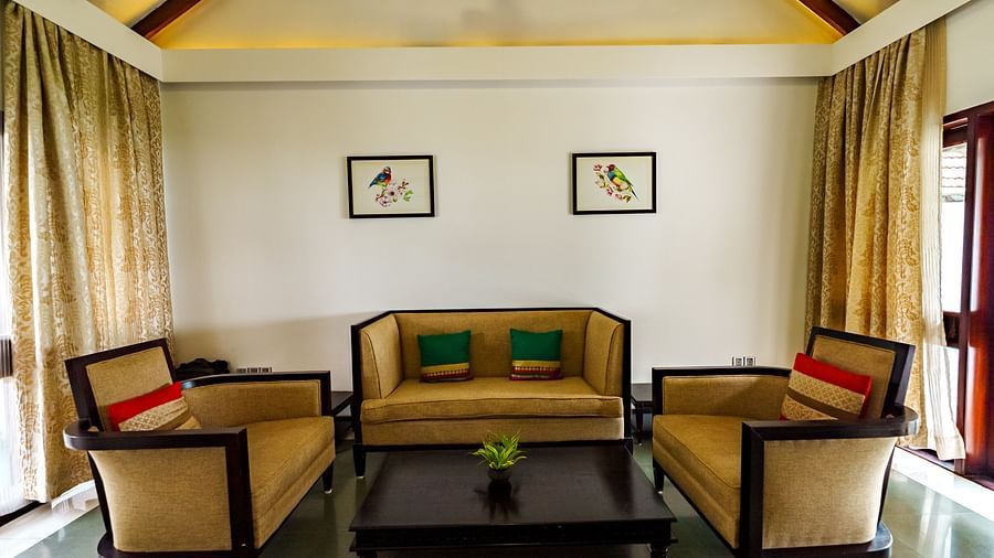 Rhythm Kumarakom - a sofa set in the living room with a coffee table