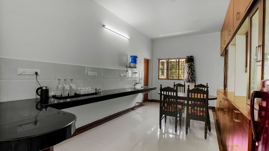 Long, well-lit kitchen and counter area at WOW Bungalow, Yercaud.
