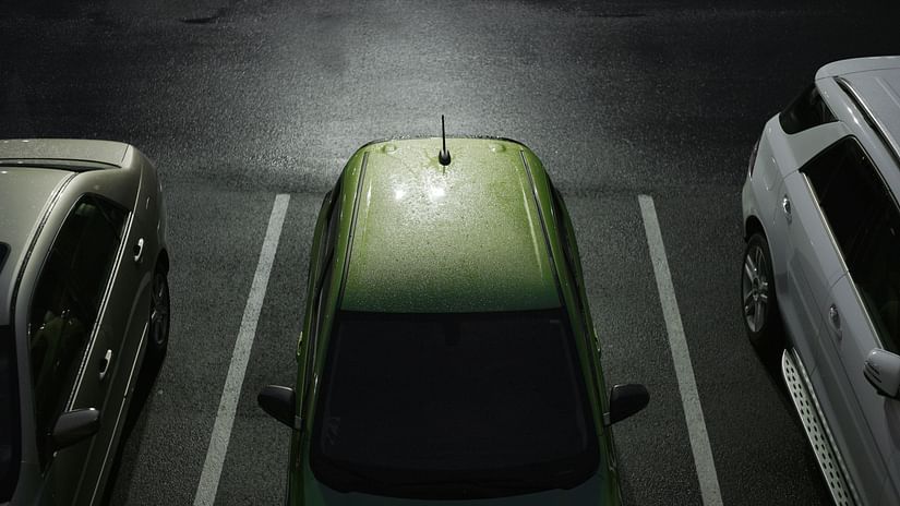light falling on a car parked in a parking spot - MGM Beach Resort Chennai