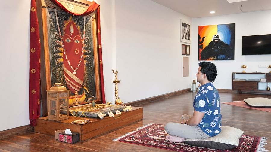 This image shows a person praying at a Hindu shrine. It suggests that the resort 