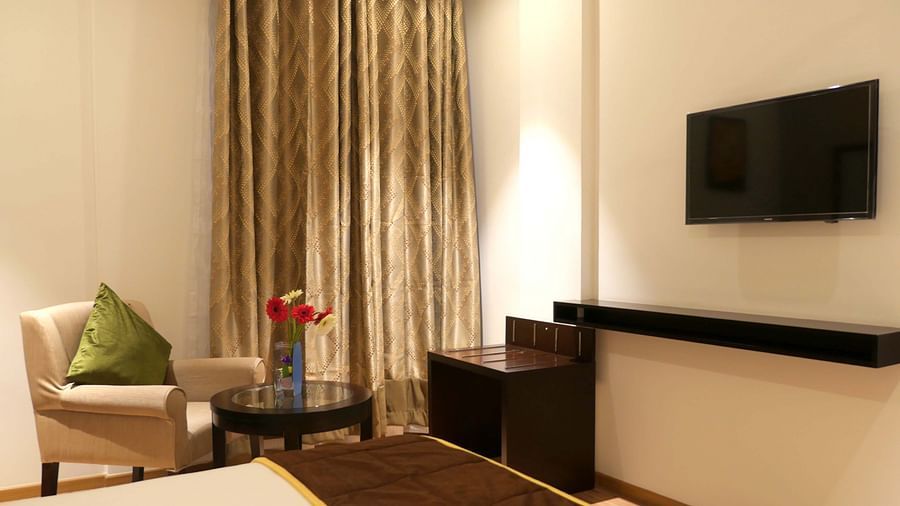 view of TV and seating area of Premium Double Room of ASR Parklane, Hosur
