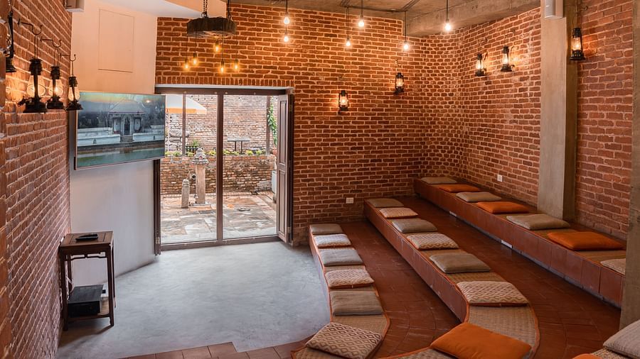 A seating area beautifully decorated with subtle lights - The Nanee