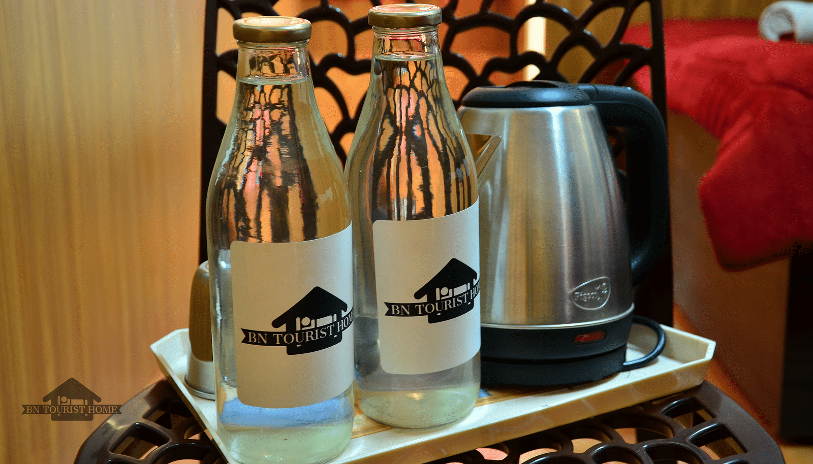 Image of two water bottles and an electric kettle at BN Tourist Home, Ooty.