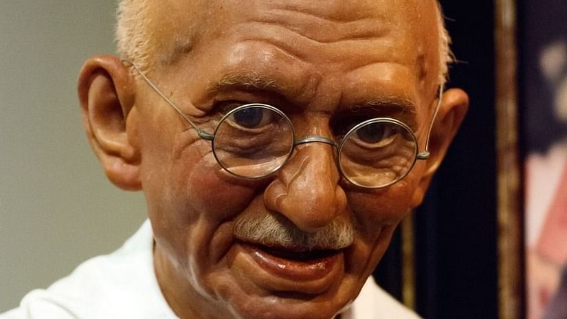 Statue of MK Gandhi holding his stick.