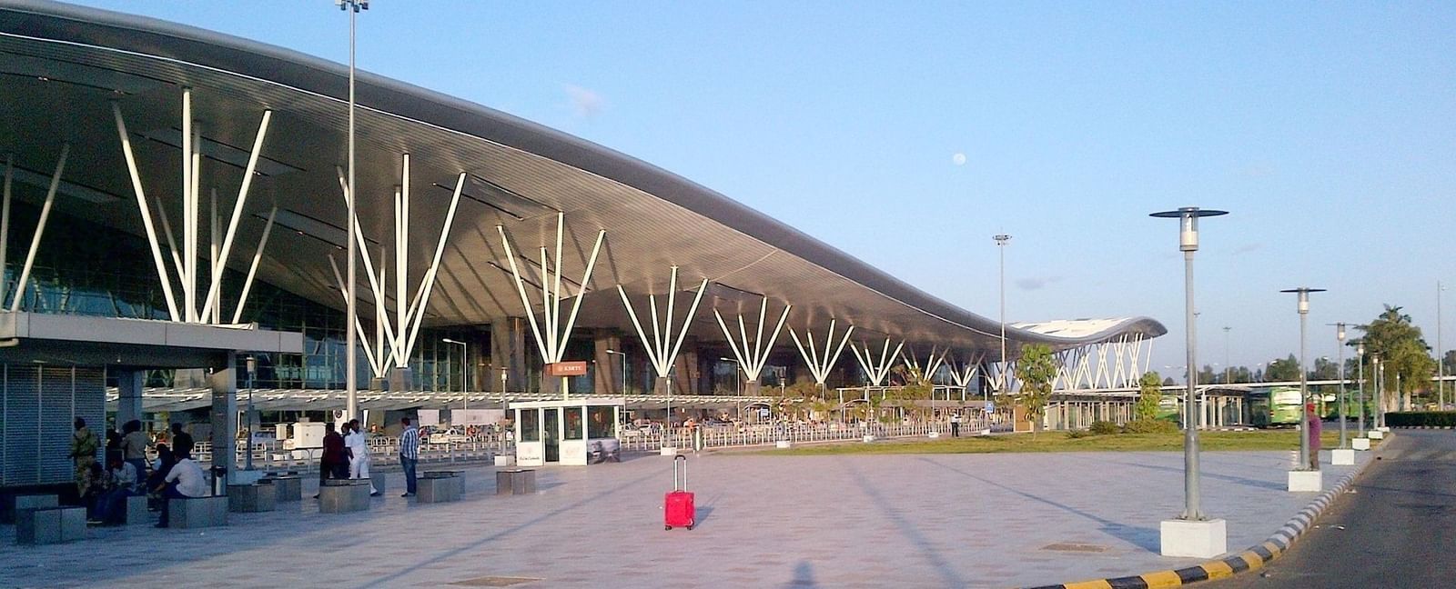 Exterior of Kempegowda International Airport terminal in Bangalore, showing modern airport structure and design.