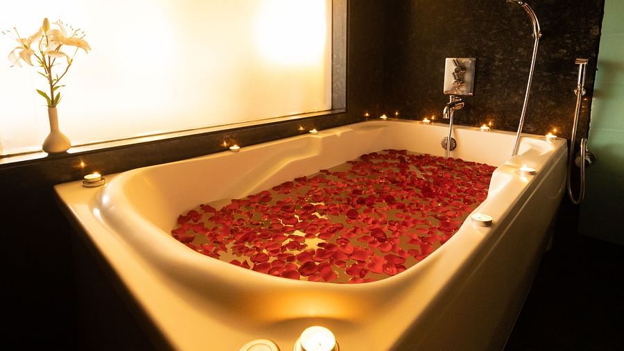 bathtub filled with rose petals