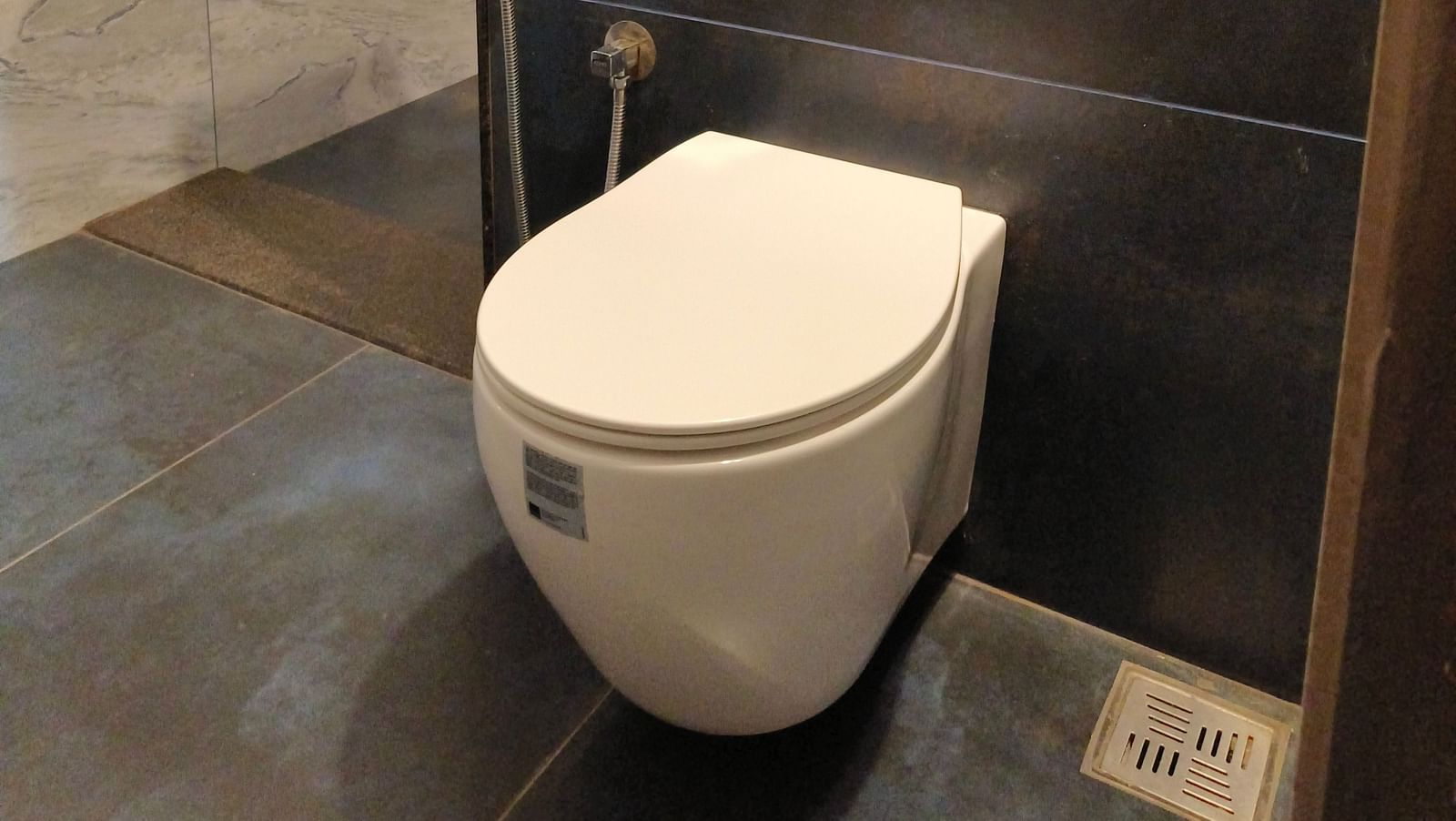 A W/C in the washroom of 103 room at Ananda Holiday Home, Wayanad 5
